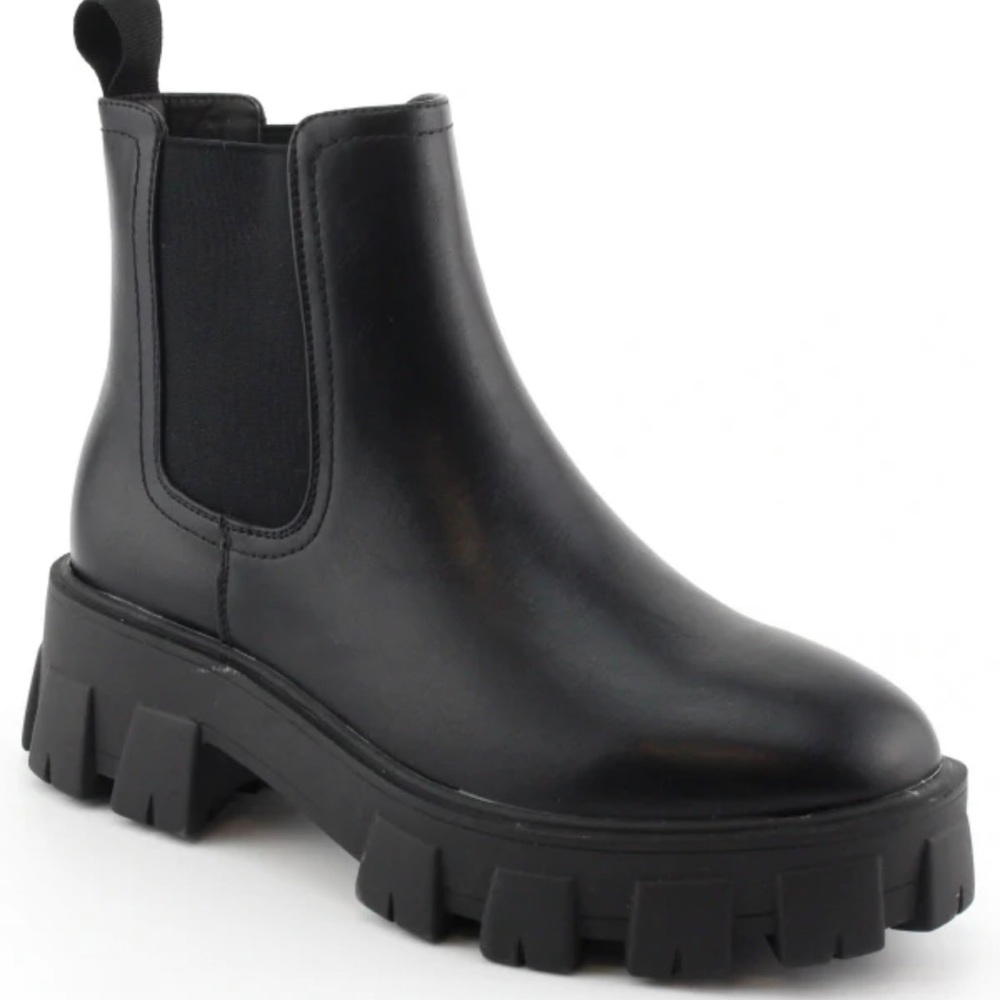 Timeless Elegance:  Show Off Your Style with our must- have solid black boots